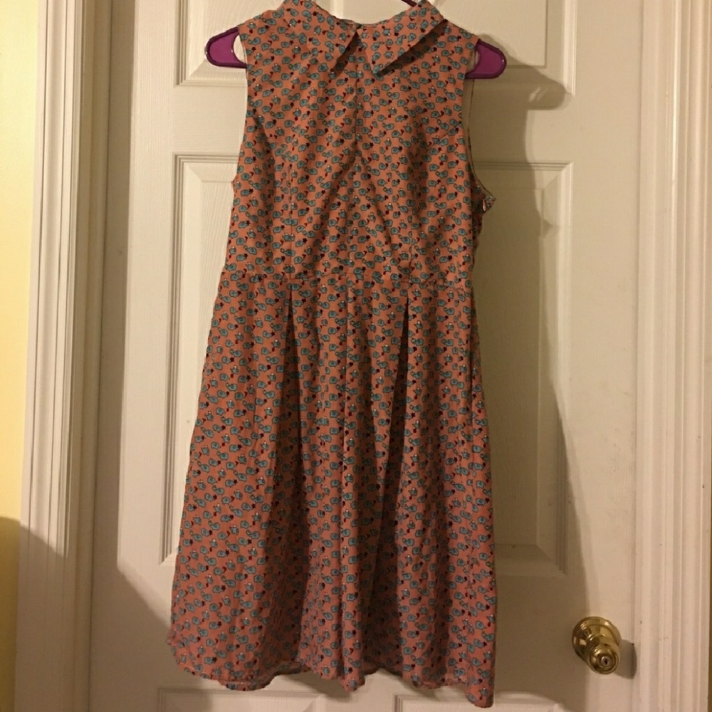 Monteau collared elephant- pattern dress